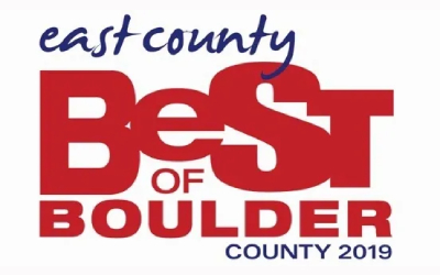 A red and white logo for the best of boulder county.