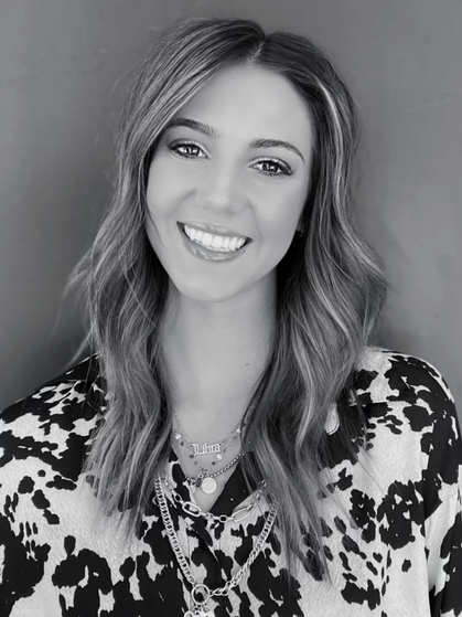 A woman with long hair and a smile.